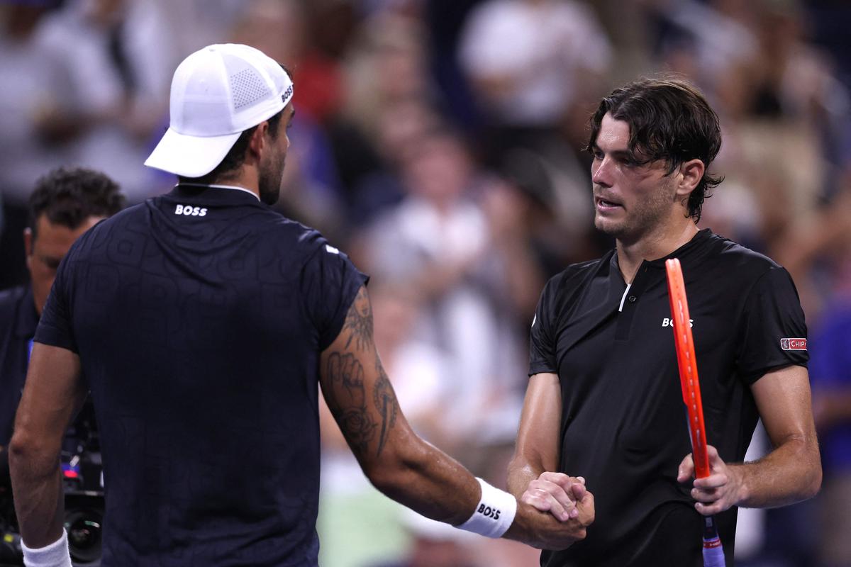 Taylor Fritz of the United States shakes hands with Matteo Berrettini of Italy after winning their Men’s Singles second-round match.