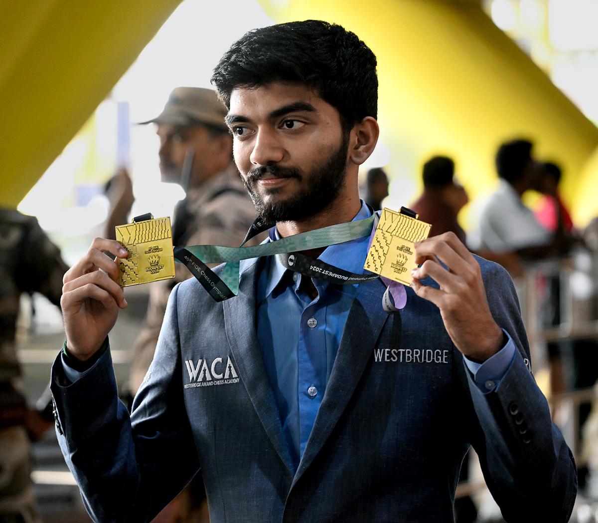 Gukesh poses with his gold medals he won at the 45th Chess Olympiad held at Budapest, Hungary in Open category.