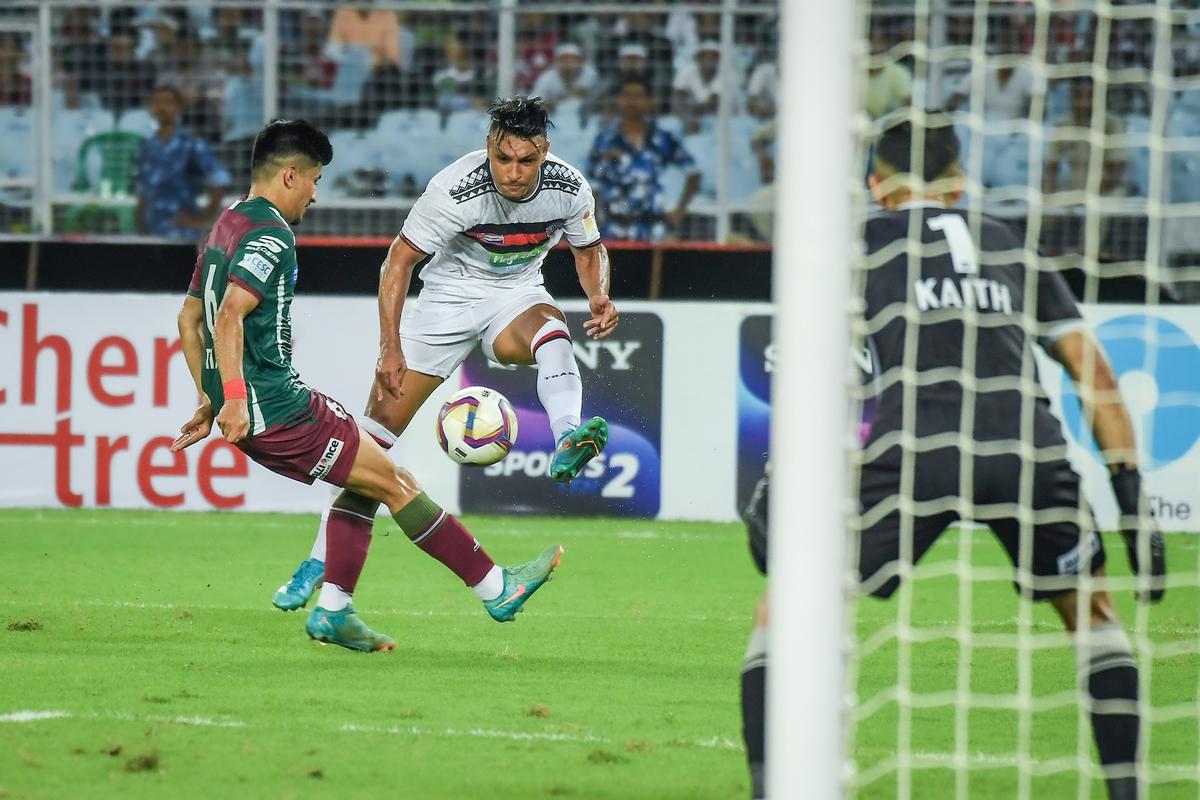 Alaaeddine Ajaraie scores the first goal for NorthEast United. He later assisted the second goal as the Highlanders came from behind to ultimately win the match on penalties.