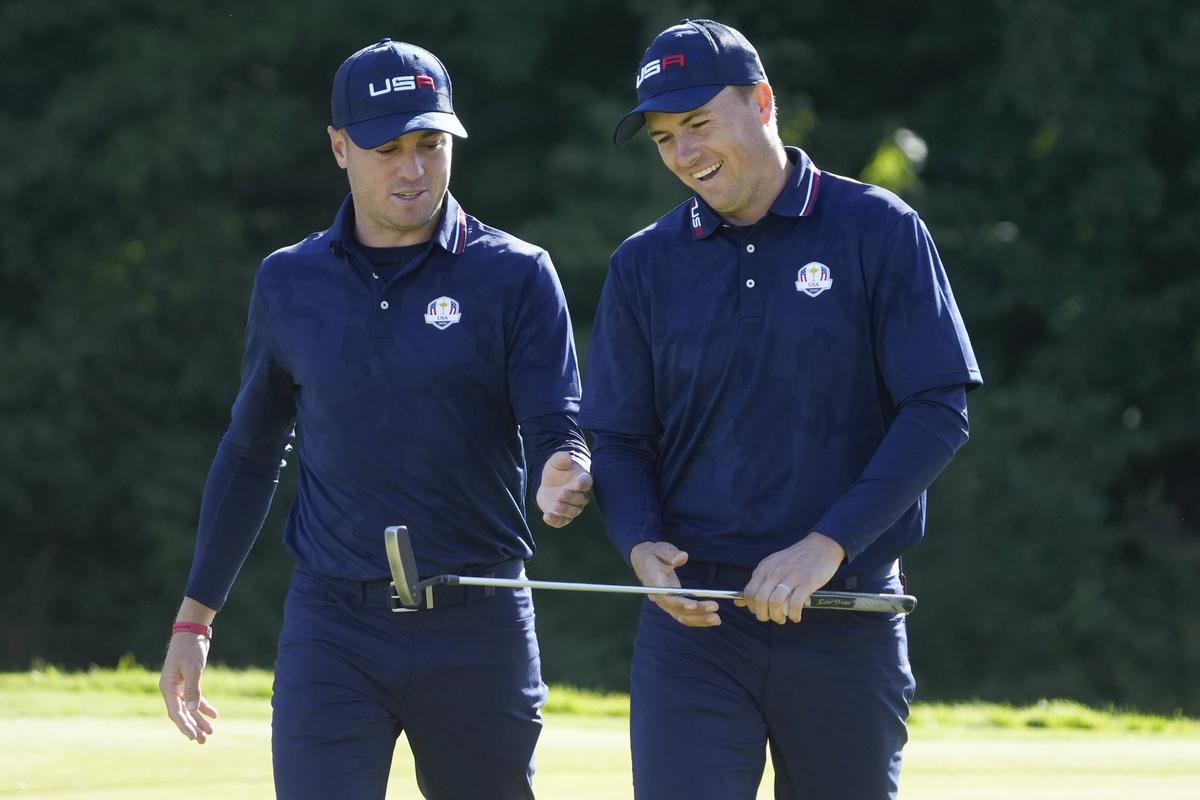 FILE PHOTO - Team USA’s Justin Thomas and Jordan Spieth react as they walk off the ninth green during a foursomes match at the Ryder Cup at the Whistling Straits Golf Course Saturday, Sept. 25, 2021, in Sheboygan, Wisconsin.