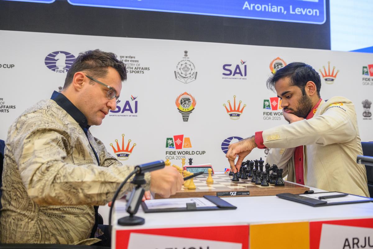 Tough luck: No. 2 seed Arjun Erigaisi (right) beat Levon Aronian (left) in a thrilling match.