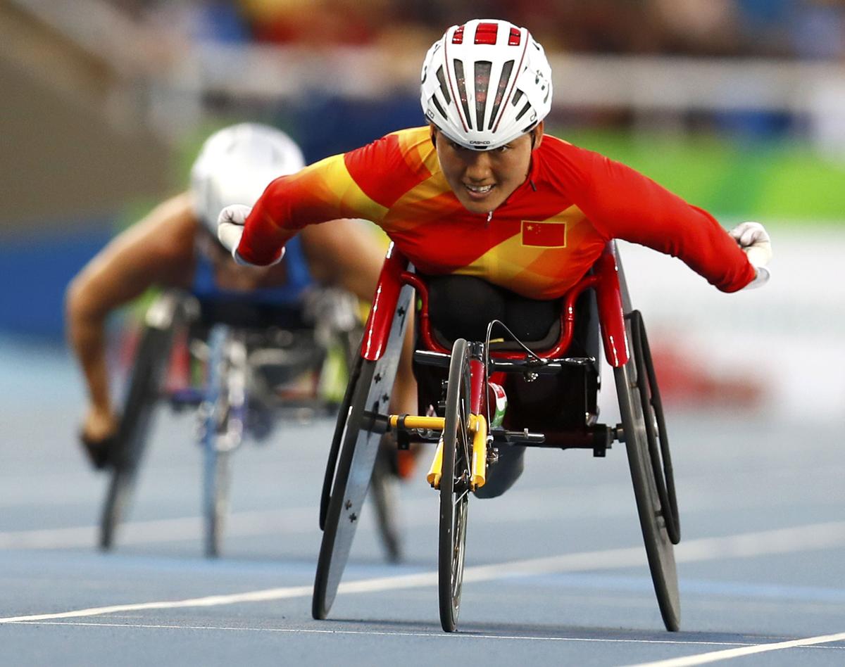 FILE PHOTO -  Zhou Hongzhuan of China sets a new world record and wins the gold medal in the event. 