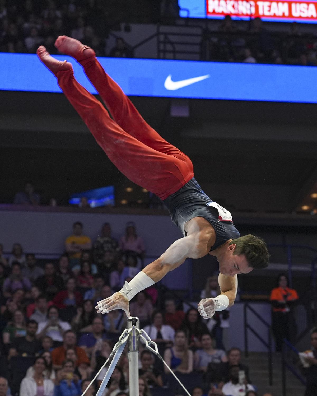 Brody Malone competes on the horizontal bar at the United States Gymnastics Olympic Trials.