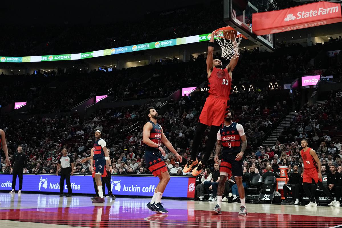Portland Trail Blazers forward Toumani Camara dunks during the second half of an NBA basketball game against the Washington Wizards.