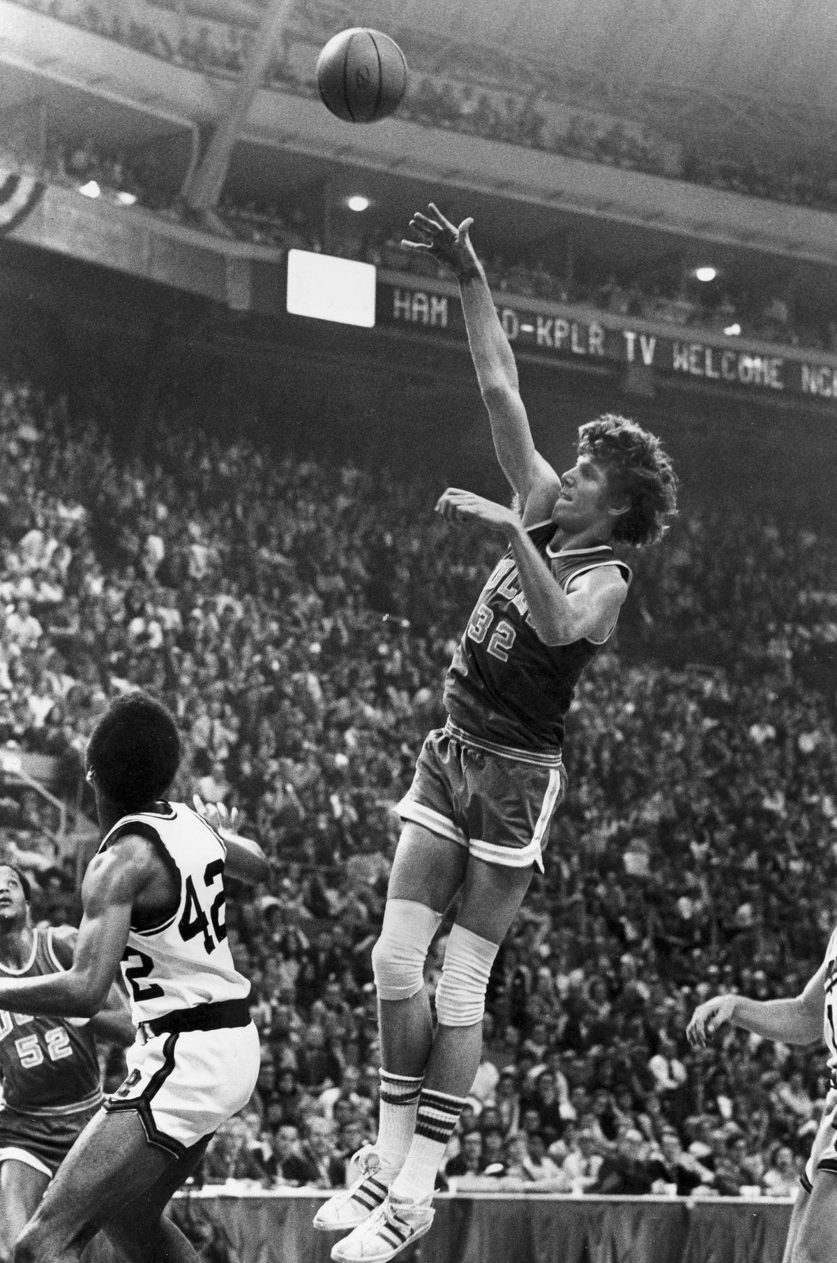 UCLA centre Bill Walton (32) shoots for two of his record 44 points against Memphis State in the final game of the NCAA college basketball tournament in St. Louis, March 26, 1973. Walton’s performance against Memphis State is still one of the greatest individual games in history.