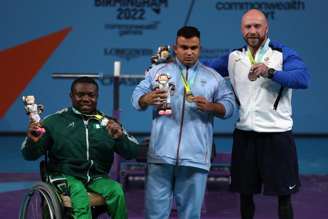 Silver medallist Ikechukwu Christian Obichukwu of Nigeria (left), gold medallist Sudhir of India and bronze medallist Micky Yule of Scotland celebrate during the Men’s Para Powerlifting Heavyweight medal ceremony on Thursday. 