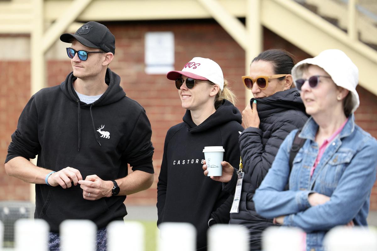 England women’s captain Heather Knight (second from left) watches the charity match against Cricket Without Borders XI at Junction Oval in Melbourne on January 30, 2025. 