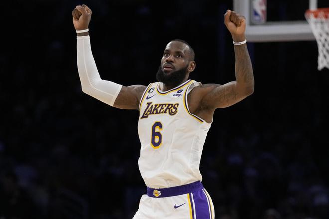 Los Angeles Lakers forward LeBron James (6) celebrates after scoring during the firs against Philadelphia 76ers in Los Angeles on Sunday. 