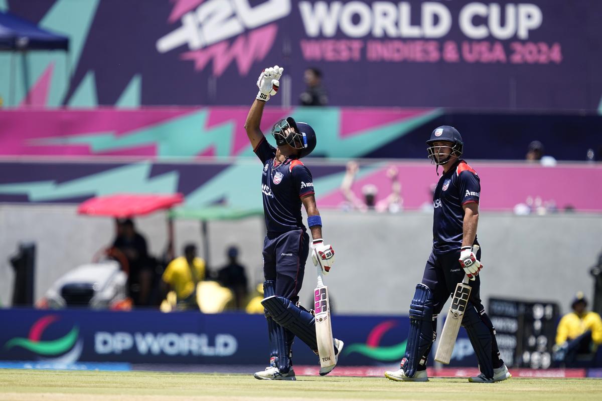 United States captain Monank Patel, left, celebrates scoring fifty. 