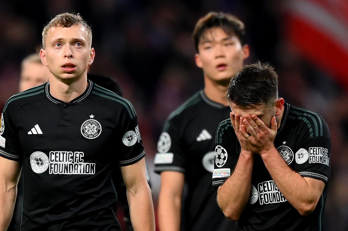 Alistair Johnston and Greg Taylor of Celtic look dejected after the team’s defeat in the UEFA Champions League match between Atletico Madrid and Celtic FC at Civitas Metropolitano Stadium on November 07, 2023 in Madrid