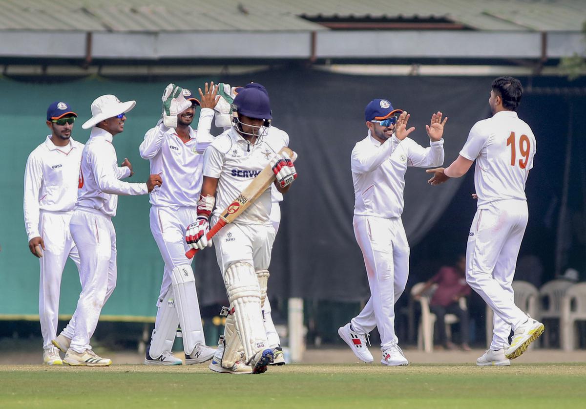 Vidarbha’s bowler Umesh Yadav celebrates the wicket of Services’ batter Lokesh Kumar during the third day of the Ranji Trophy cricket match between Services and Vidarbha, in Nagpur.