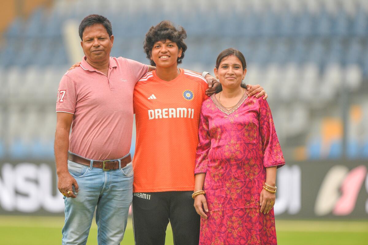Richa Ghosh with her parents after Day 2 of the Test match between India and Australia at the Wankhede Stadium in Mumbai.