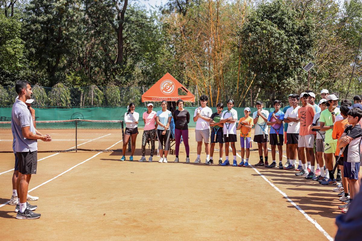 Indian Tennis player Yuki Bhambri with kids at the RG Tennis Academy, in Chandigarh. 