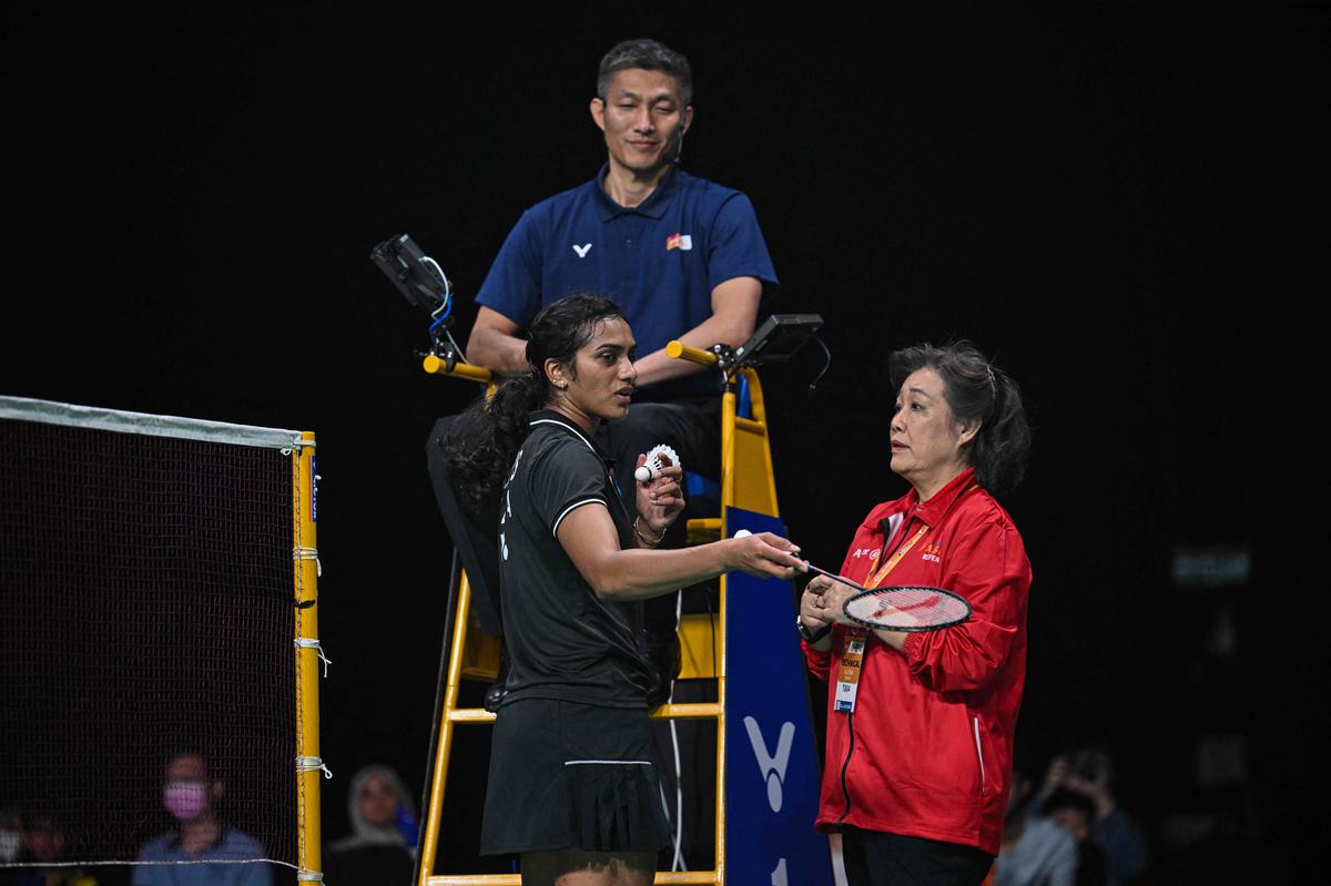 India’s P. V. Sindhu speaks with a technical official as she plays against Thailand’s Supanida Katethong in their women’s singles finals match at the Badminton Asia Team Championships.