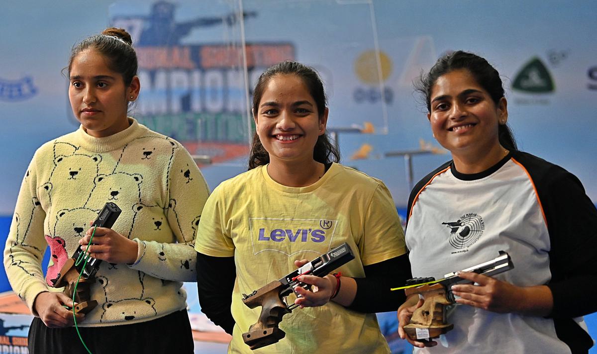 Simranpreet Kaur Brar, champion Riya Shirish and Rahi Sarnobat, the sports pistol medallists in the National shooting championship in Delhi on Monday.