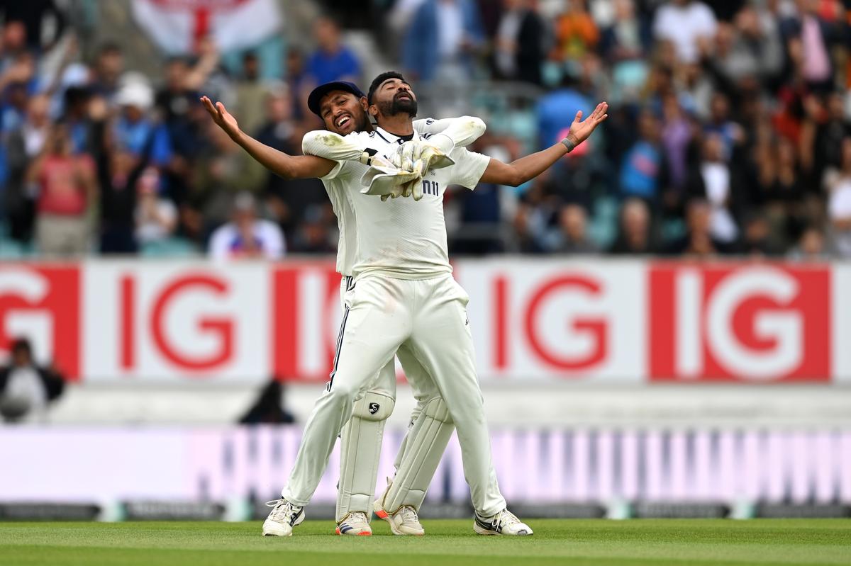 Mohammed Siraj of India celebrates the match-winning wicket of Gus Atkinson of England with teammate Dhruv Jurel on day five of the 5th Test Match at the Oval. 