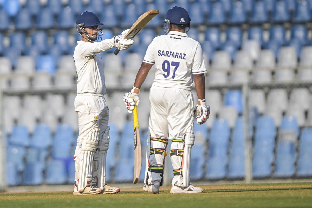 Mumbai’s Siddhesh Lad (L) celebrates his fifty against Pondicherry.