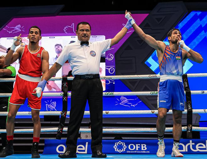 Standing tall: Nishant Dev after winning his quarter-final bout.