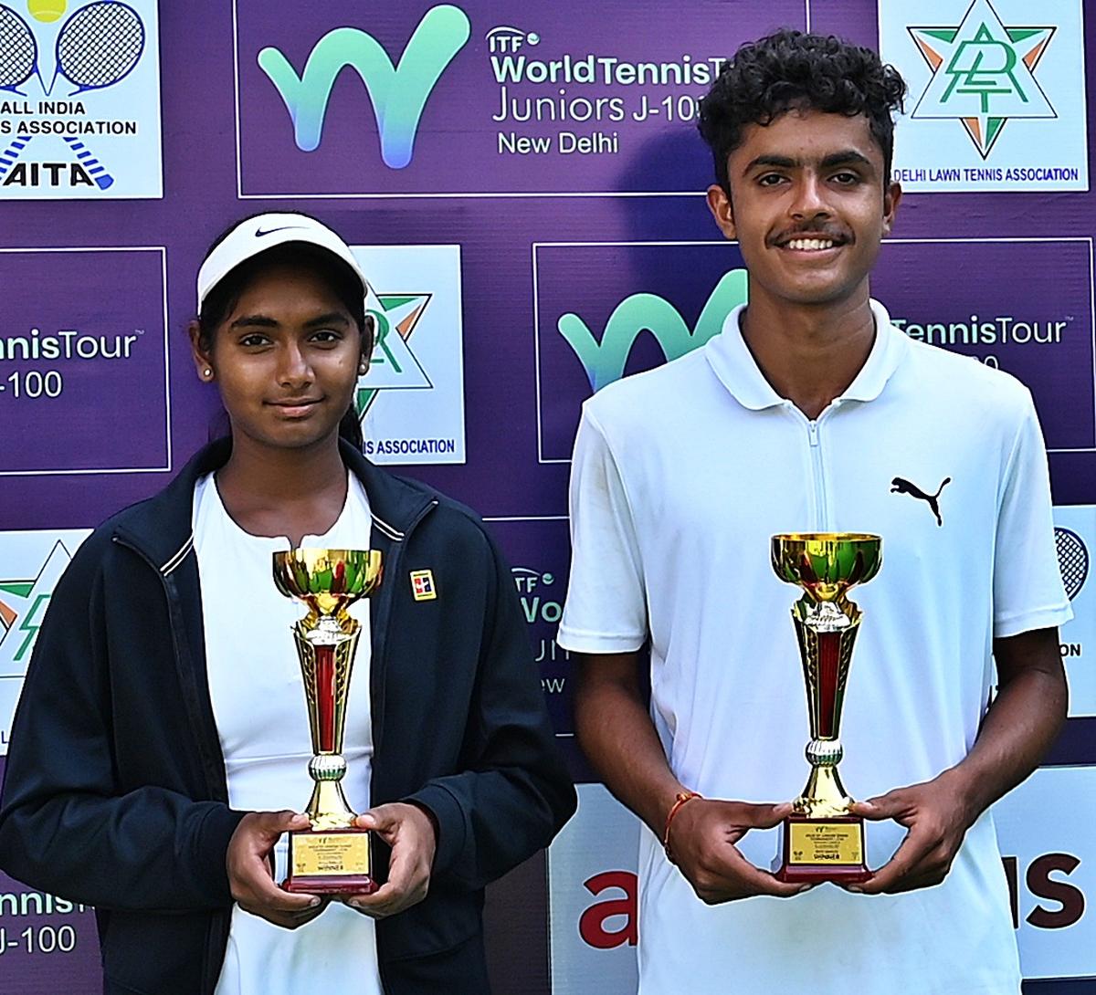 Champions Rishitha Basireddy and Arjun Rathi in the ITF junior tennis tournament in Delhi on Saturday.