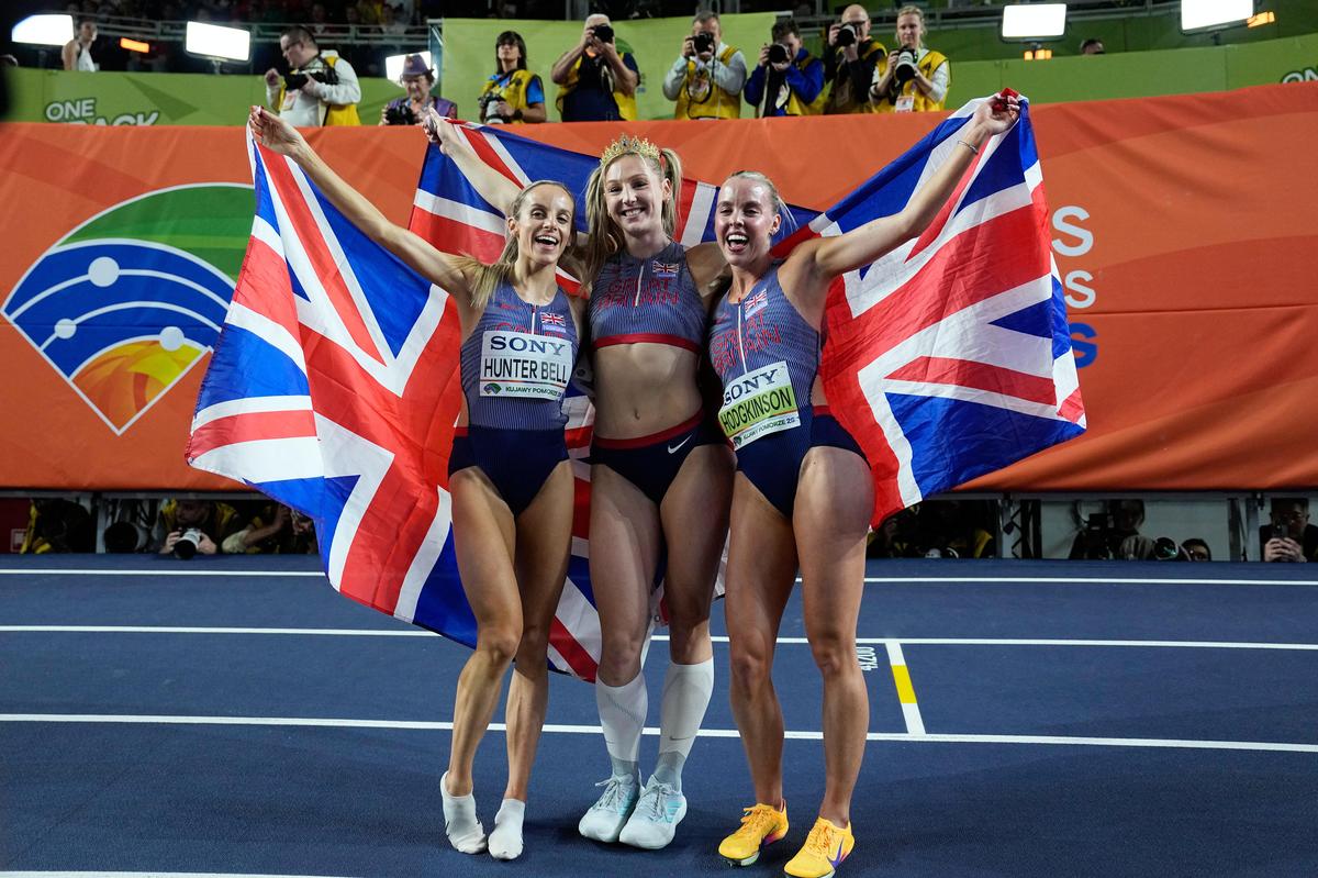 Britain’s Georgia Hunter Bell (left) - women’s 1500m champion, Molly Caudery (centre) - women’s pole vault winner, and Keely Hodgkinson (right) - women’s 800m gold medallist, at the World Athletics Indoor Championships in Torun, Poland, on Sunday.
