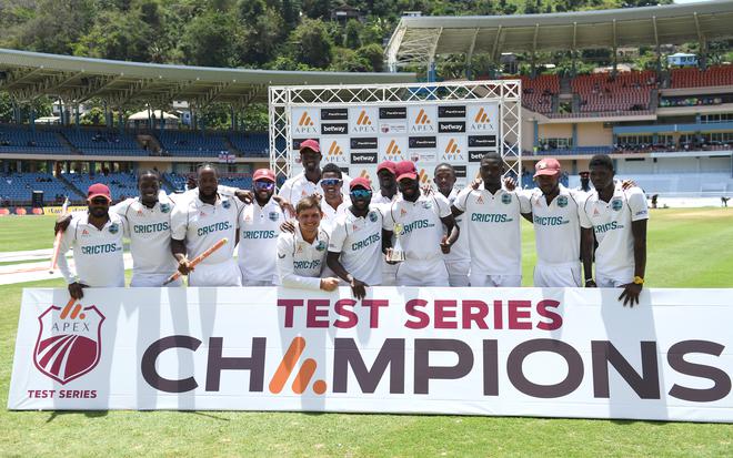 West Indies players celebrate after winning the third Test against England at National Cricket Stadium in Grenada. 