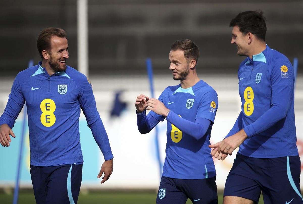 From left, England’s Harry Kane, James Maddison and Harry Maguire speak during a training session at St. George’s Park, Burton upon Trent, Tuesday.