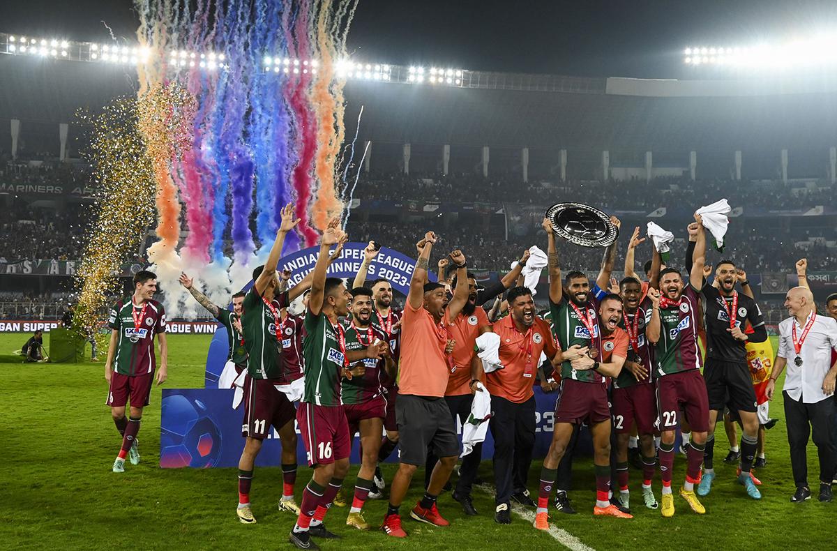 Mohun Bagan Super Giant players celebrate after beating Mumbai City FC in the last league match and winning the Indian Super League (ISL) 2023-24 League Shield, at Salt Lake Stadium.