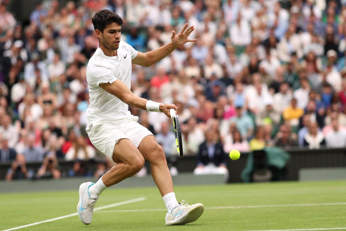 Alcaraz plays a forehand using a Babolat at the Wimbledon Championships 2024 in London, England.