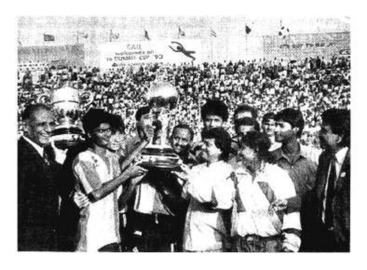 Members of the victorious East Bengal team, with the Durand Cup and the Simla Trophy, at the Ambedkar Stadium in New Delhi on Wednesday. At extreme left is the Chief of the Naval Staff, Admiral V.S. Shekawat.