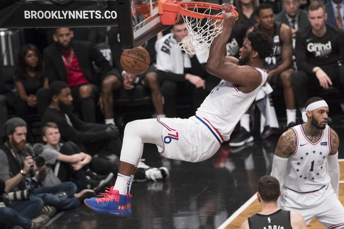 Philadelphia 76ers center Joel Embiid dunks during an NBA basketball playoff series against the Brooklyn Nets.