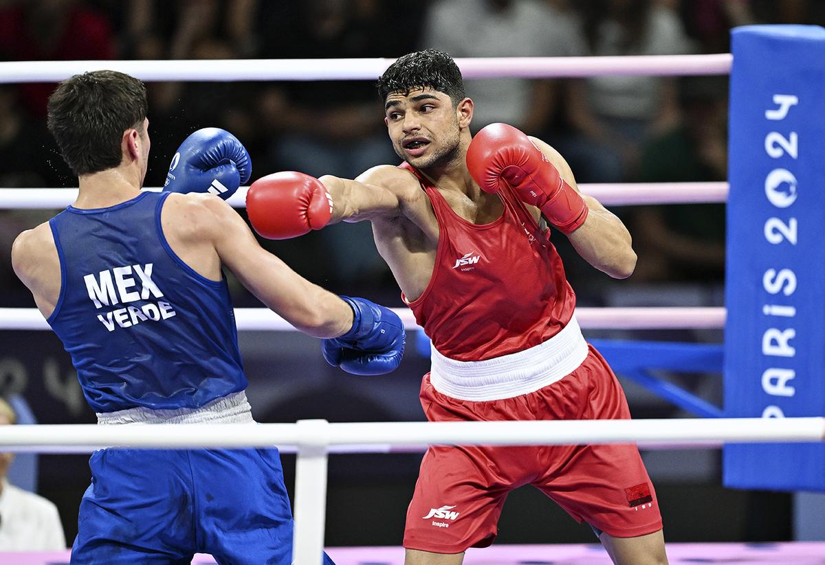 Nishant Dev of India in action against Marco Alonso Verde Alvarez of Mexico. 