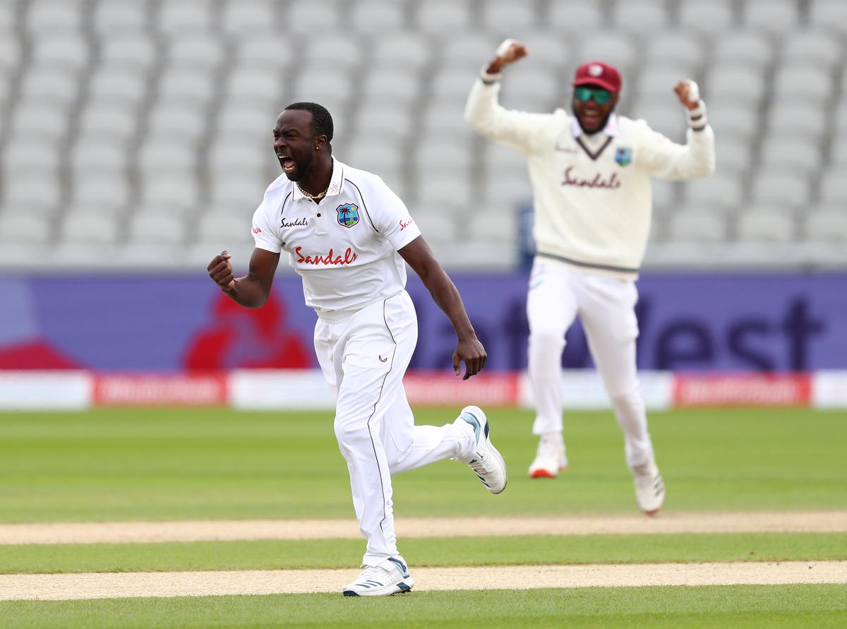 FILE PHOTO: West Indies’ Kemar Roach celebrates taking the wicket of England’s Dom Sibley during the third Test against England at Old Trafford.