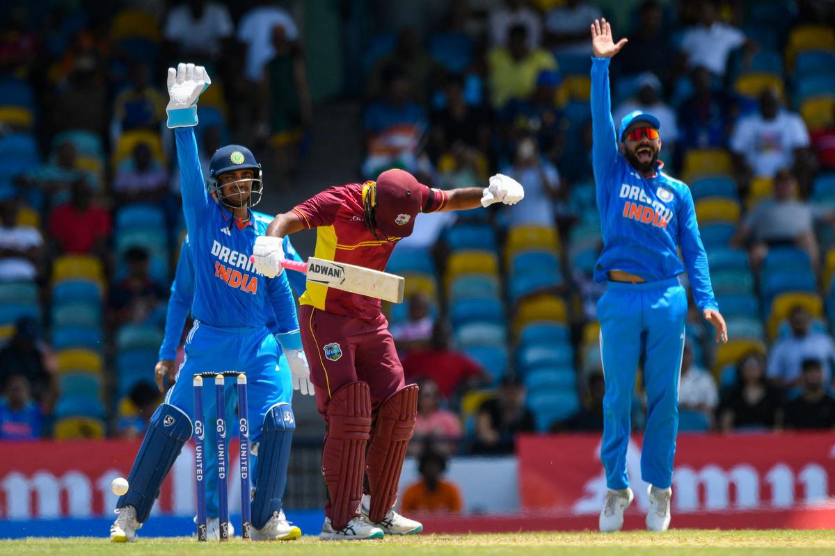 Yannic Cariah (C), of West Indies, lbw by Kuldeep Yadav as Ishan Kishan (L) and Shubman Gill (R) celebrate during the first One Day International. 