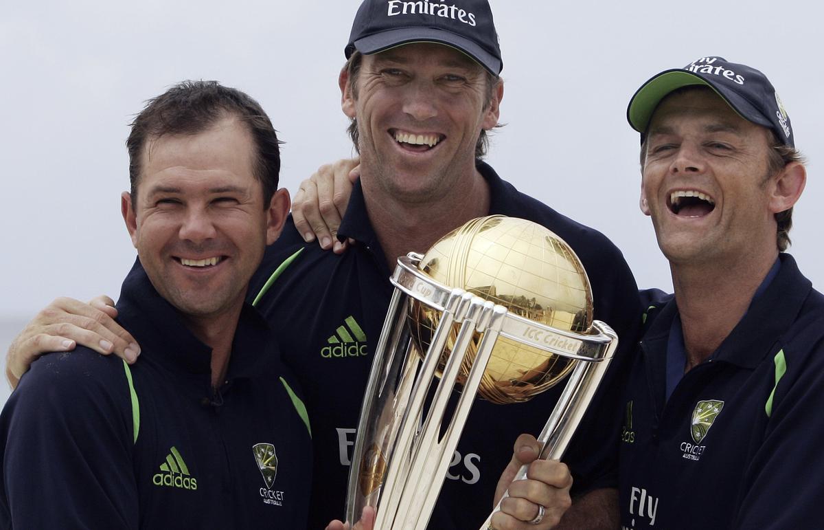 Australia’s Glenn McGrath, center, Adam Gilchrist, right, and Ricky Ponting show off the Cricket World Cup trophy during a photocall in Bridgetown, Barbados.