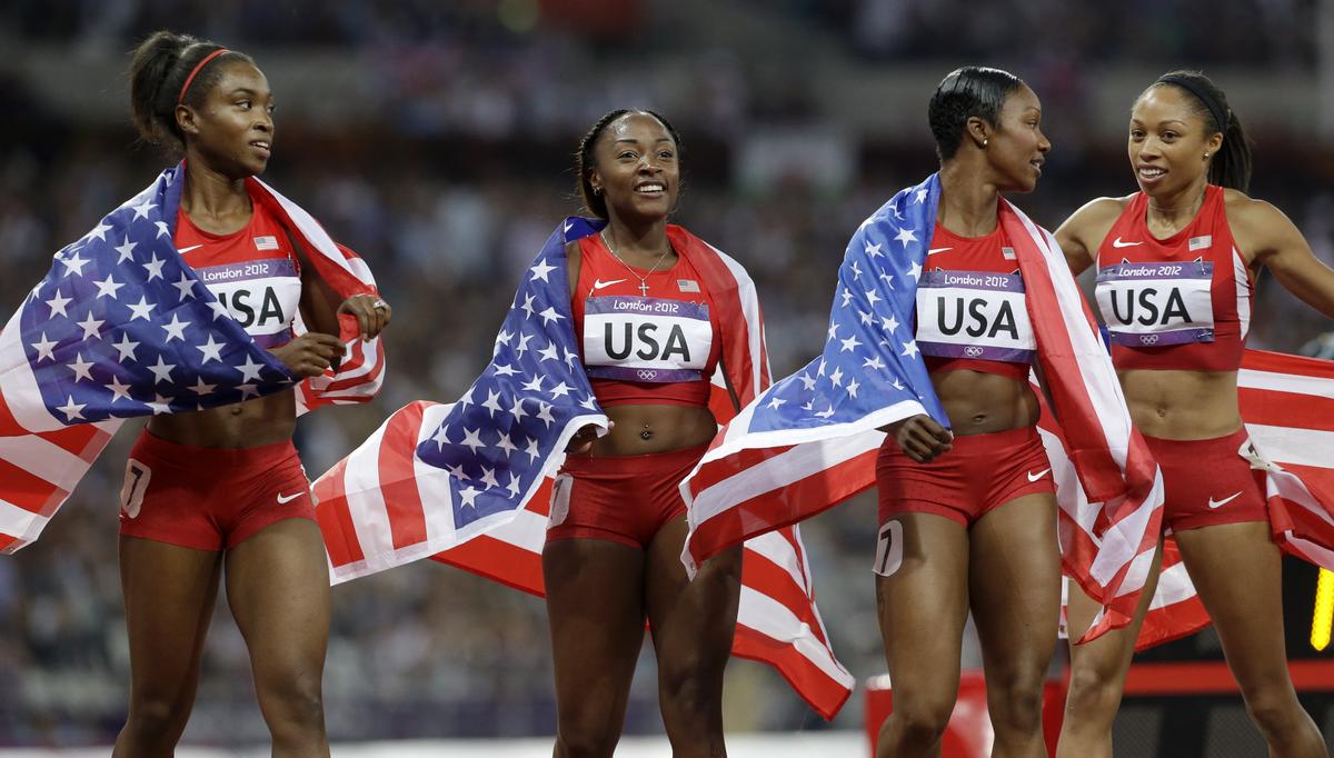 From left to right: USA’s Tianna Madison, Bianca Knight, Carmelita Jeter and Allyson Felix set a new world record in women’s 4x100m relay at the Olympic Stadium in London on August 10, 2012. 