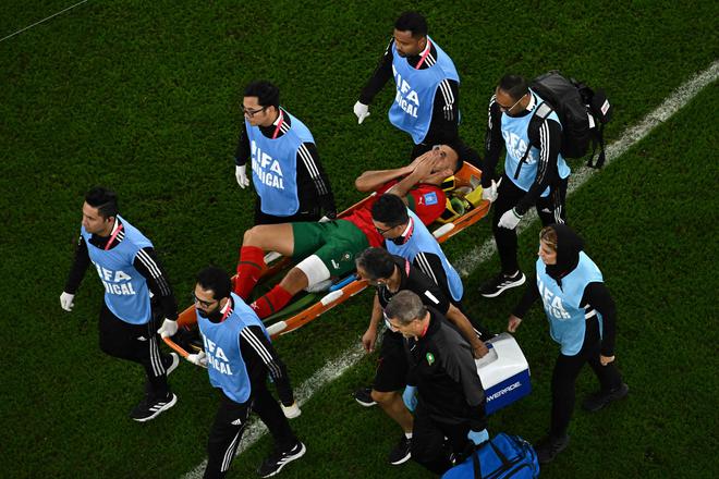 Morocco’s Romain Saiss is carried away on a stretcher during Morocco vs Portugal quarterfinal.