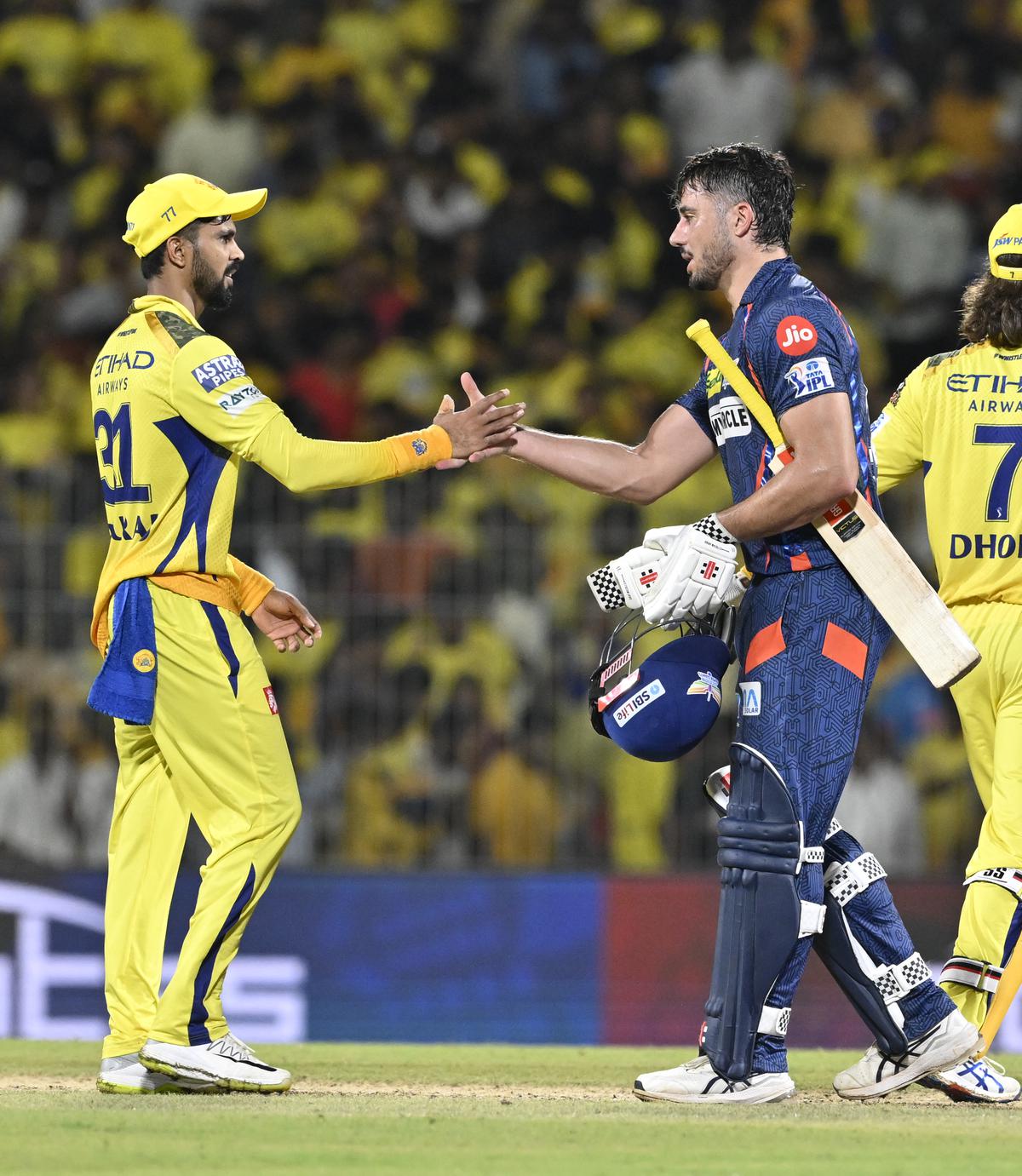 Ruturaj Gaikwad, who scored an unbeaten 108, greets Marcus Stoinis after the match. 