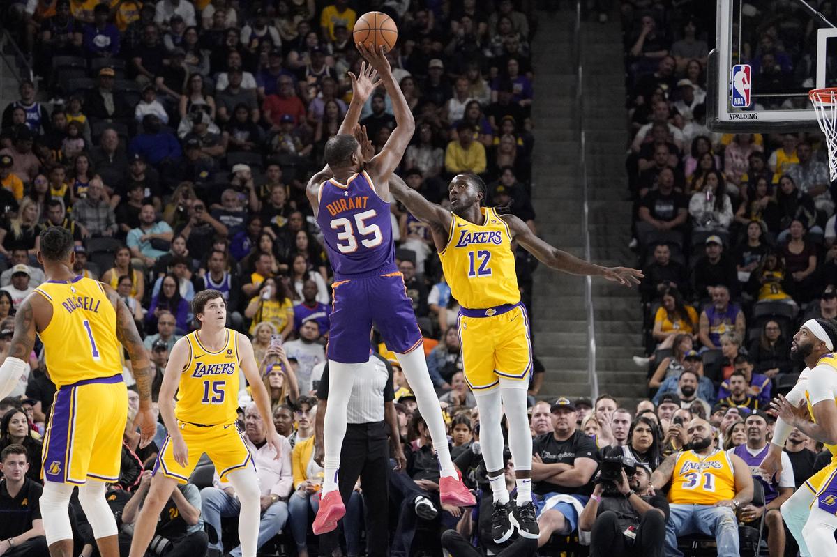 James posts triple double as Lakers hold off Suns