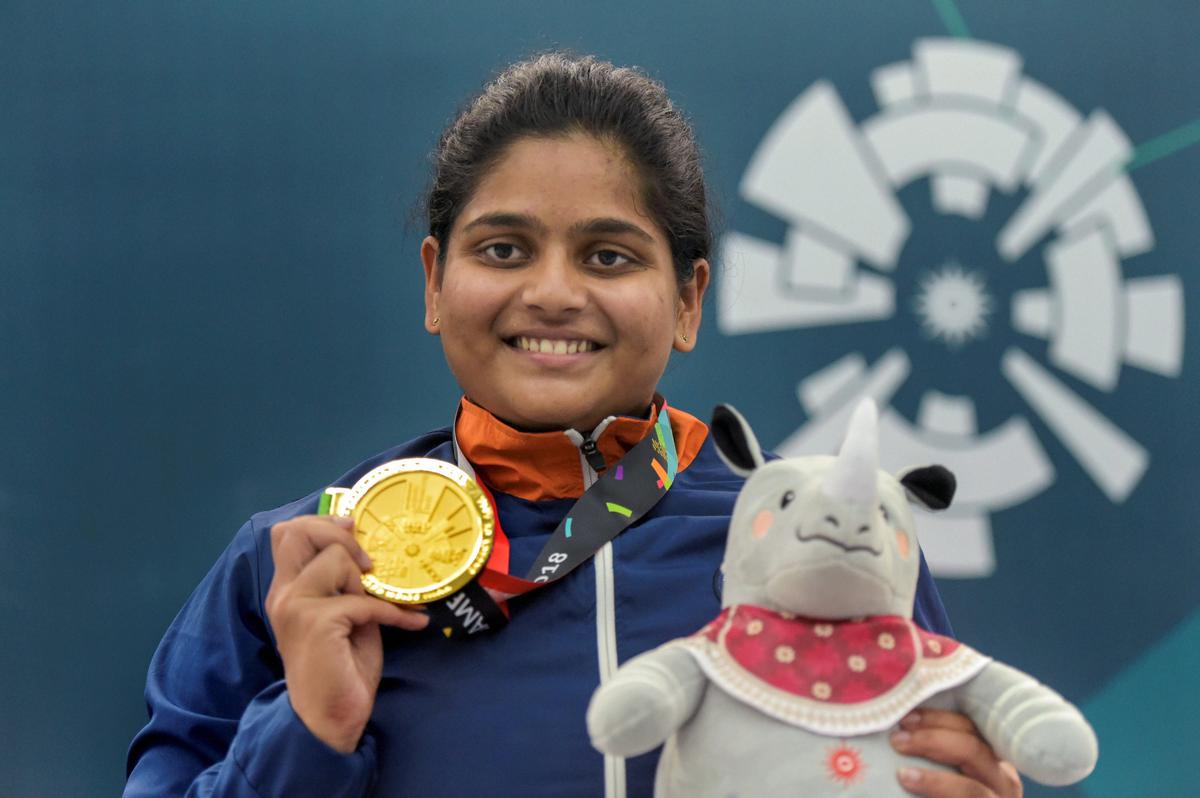 Gold medallist shooter Rahi Sarnobat poses after the medal ceremony of women’s 25m pistol event during the 18th Asian Games.