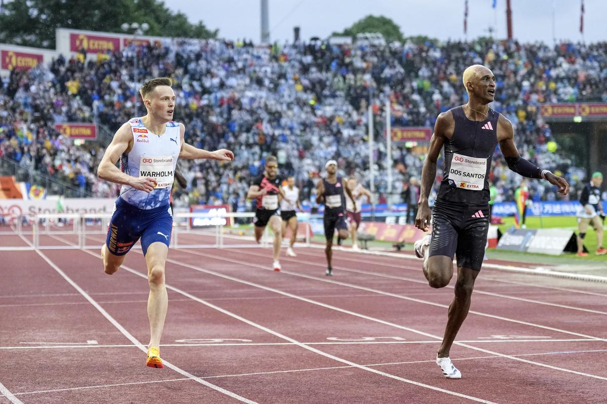 Brazil’s Alison Dos Santos (right) and Norway’s Karsten Warholm (left) after the men’s 400m hurdles final during the Diamond League meeting at Bislett Stadium in Oslo, Norway on Thursday.