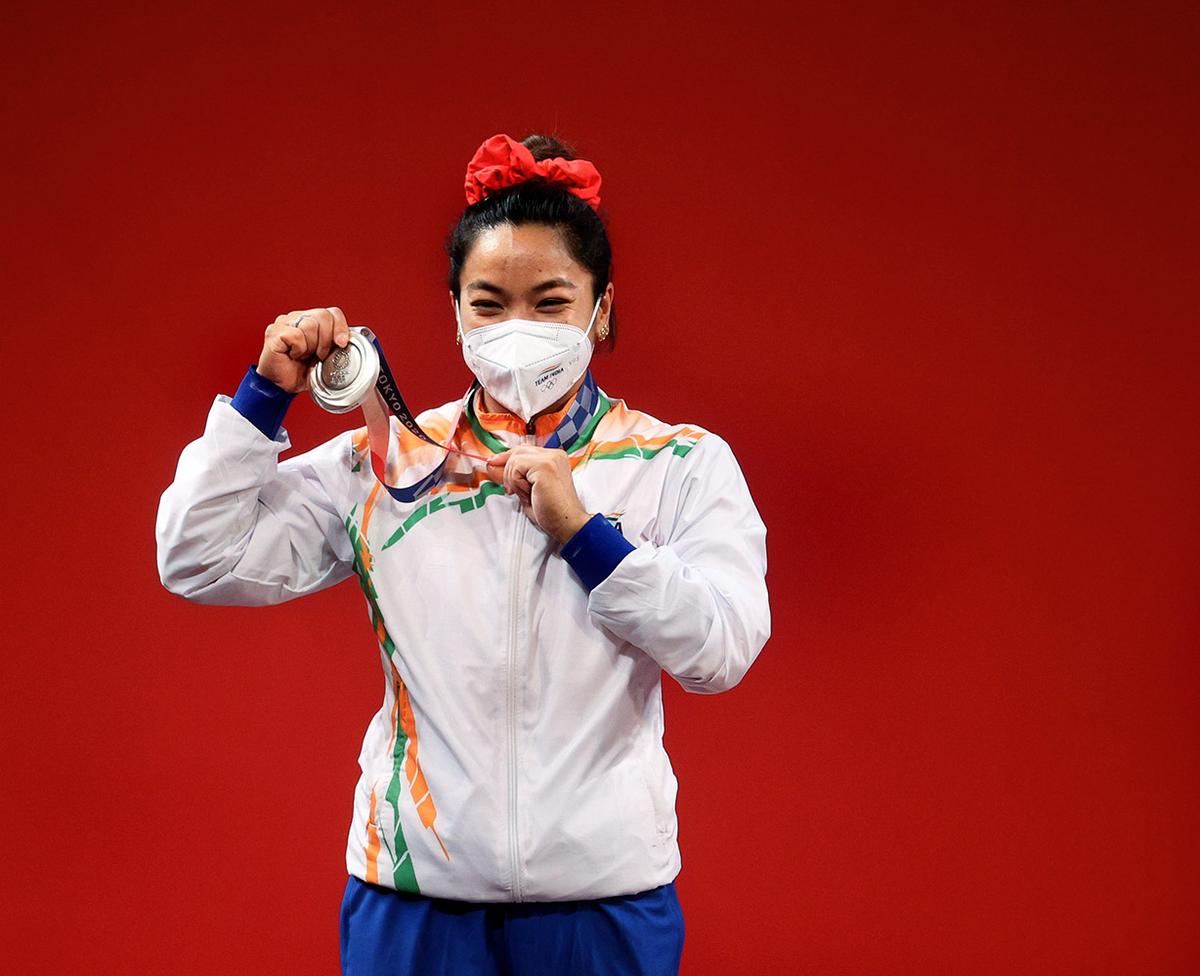 Silver medalist Chanu Saikhom Mirabai of Team India poses with the silver medal.