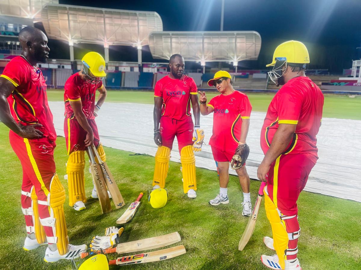 Abhay, a seasoned coach from the Indian domestic circuit, talking to the Uganda players during a training session.