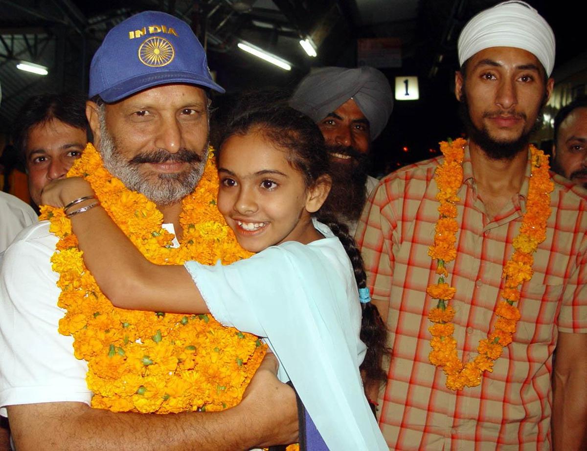 File photo: Indian Hockey team Assistant Coach Baldev Singh is greeted by his daughter Parvinder Kaur upon his return after winning the Asia Cup