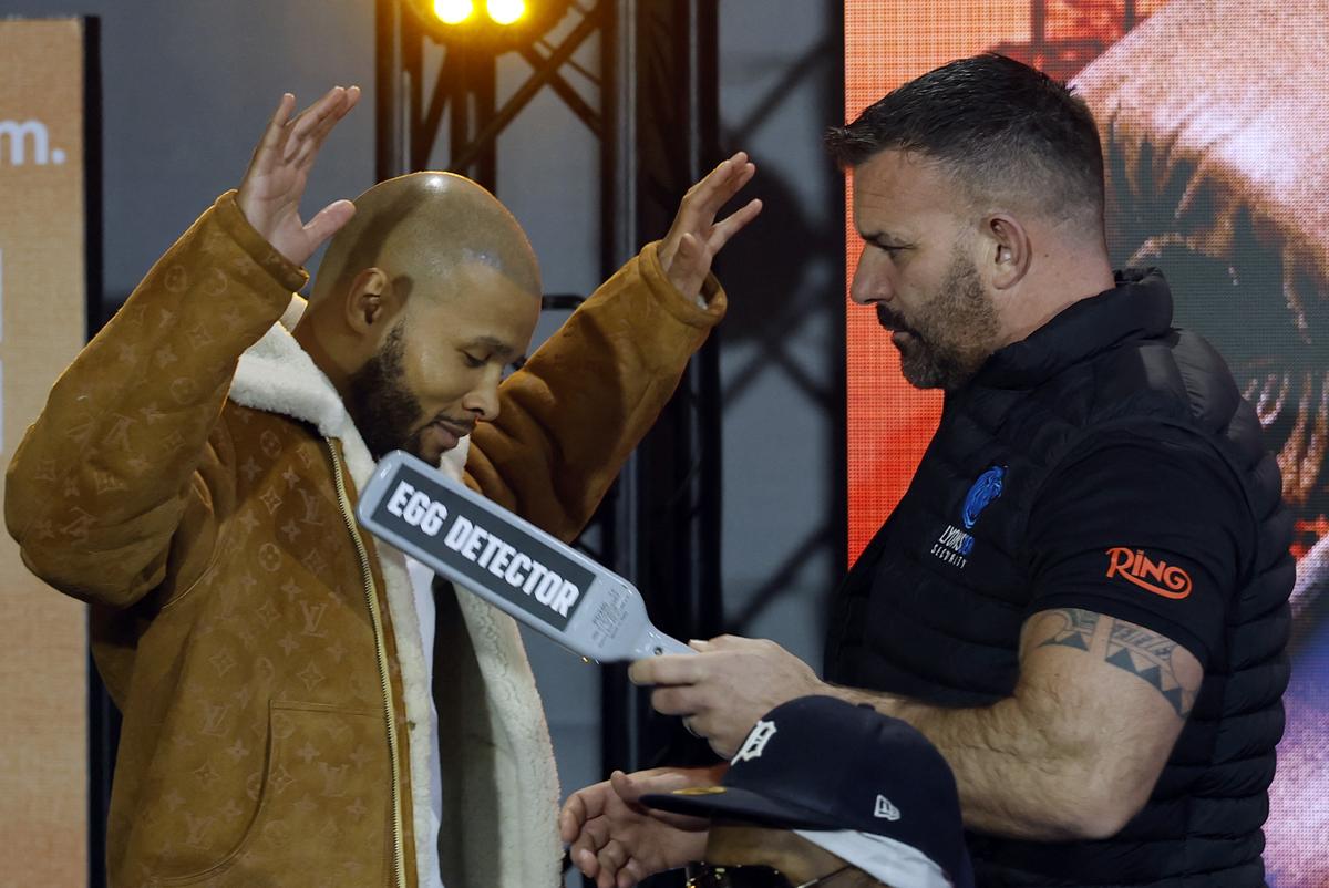 Chris Eubank Jr with a member of security held a scanner reading ‘Egg Detector’ during the press conference on February 27.