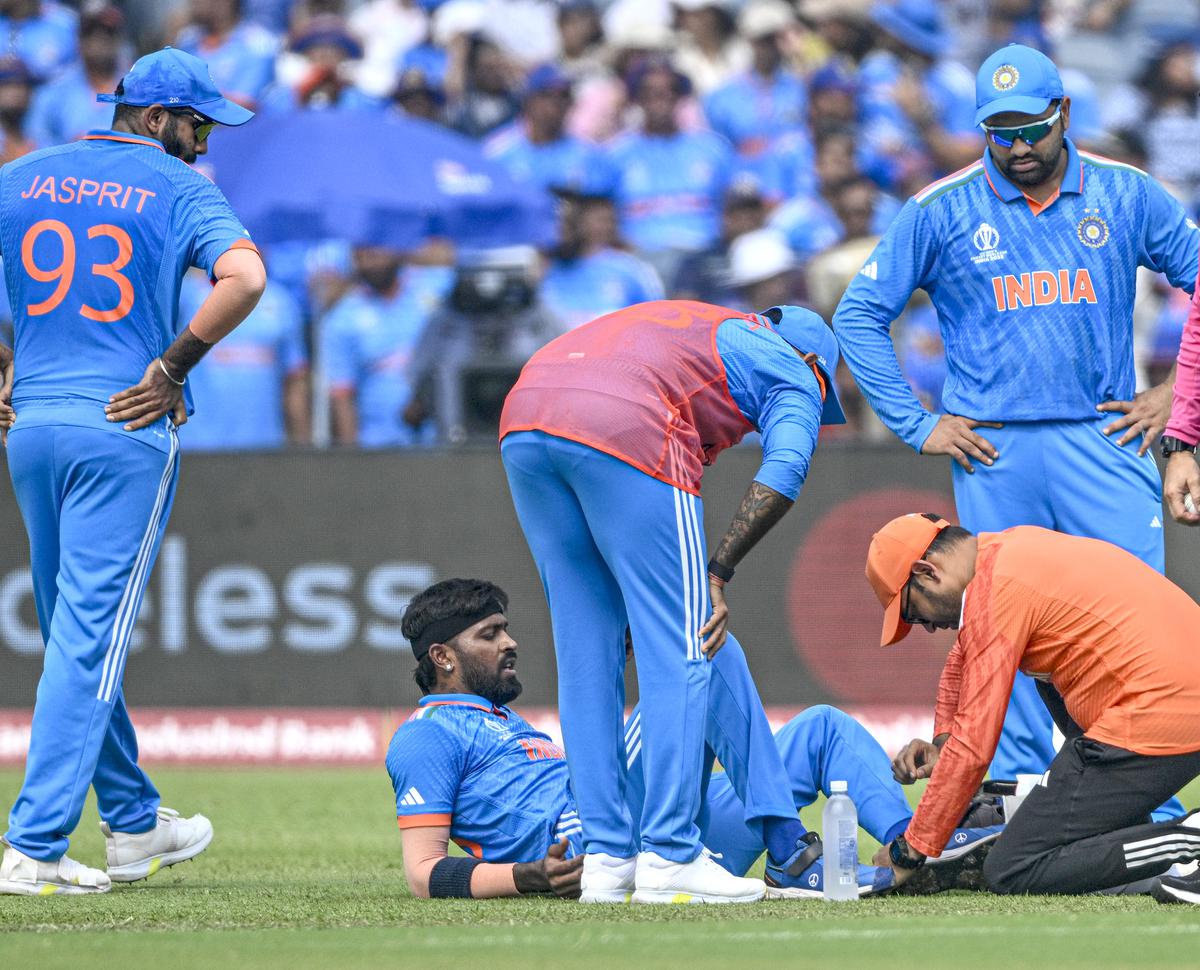 Pandya sits on the field after getting injured  during the 2023 ICC Men’s Cricket World Cup one-day international (ODI) matcha between India and  Bangladesh at the Maharashtra Cricket Association Stadium.