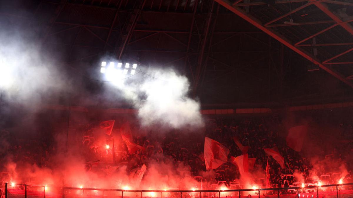 Groningen vs Ajax Dutch league game suspended after smoke bombs thrown on the pitch