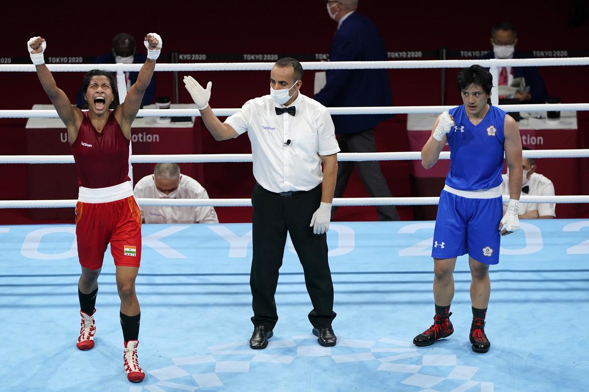 India’s Lovlina Borgohain, left, reacts to the judge’s decision in her victory over Nien-Chin Chen of Chinese Taipei in their women’s welterweight 69kg quarterfinal boxing match at the 2020 Summer Olympics.