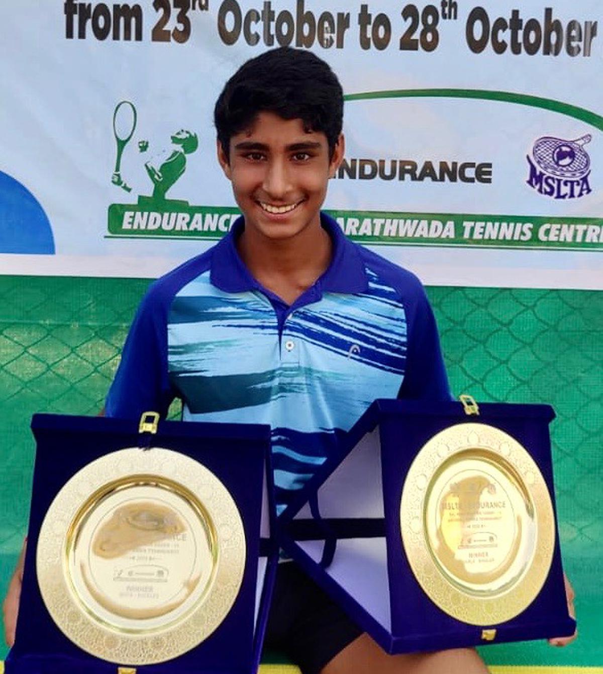 Tavish Pahwa with his twin trophies in the National under-14 tennis championship in Aurangabad on Saturday