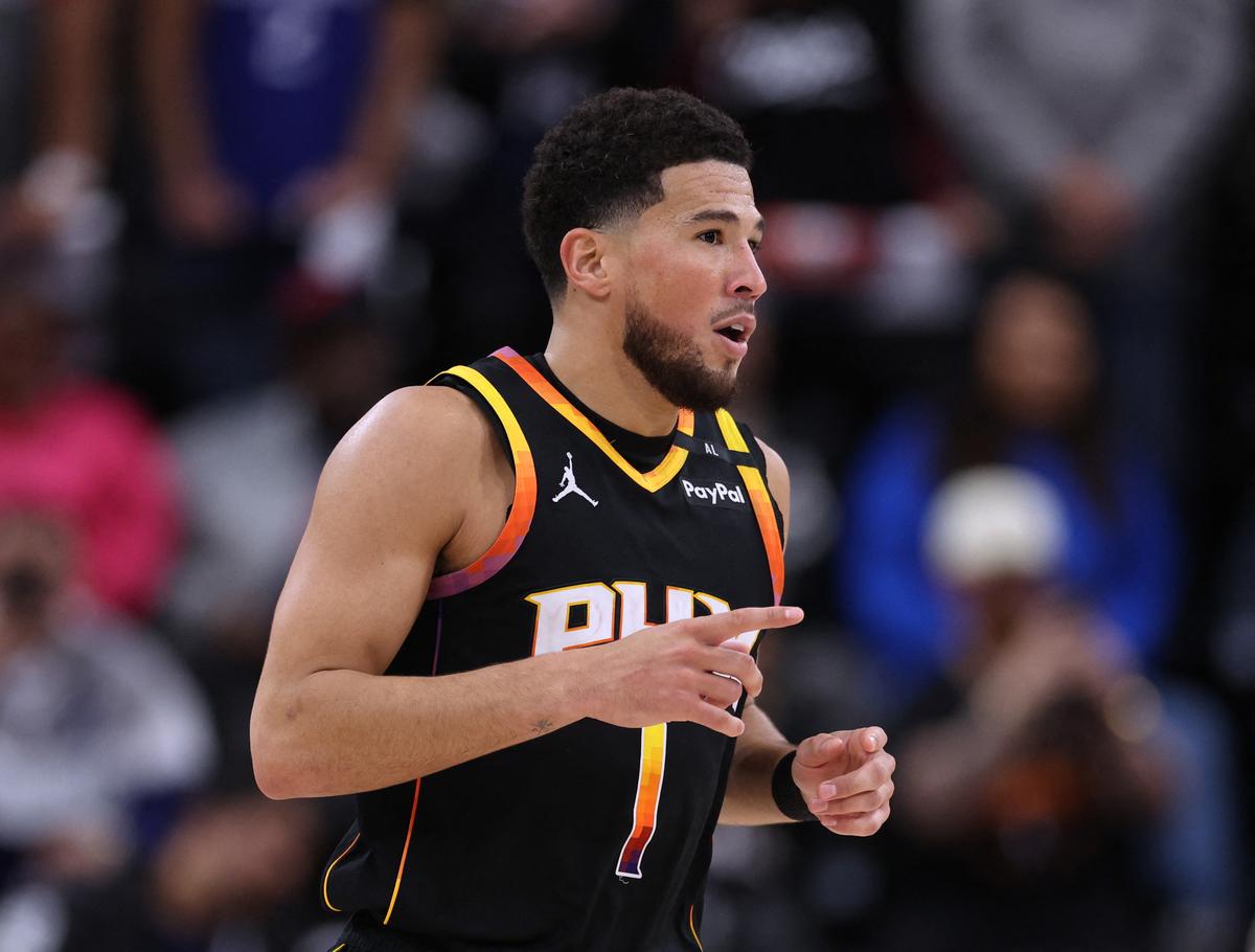 Devin Booker #1 of the Phoenix Suns celebrates his jumper during a 125-119 Suns win over the LA Clippers.