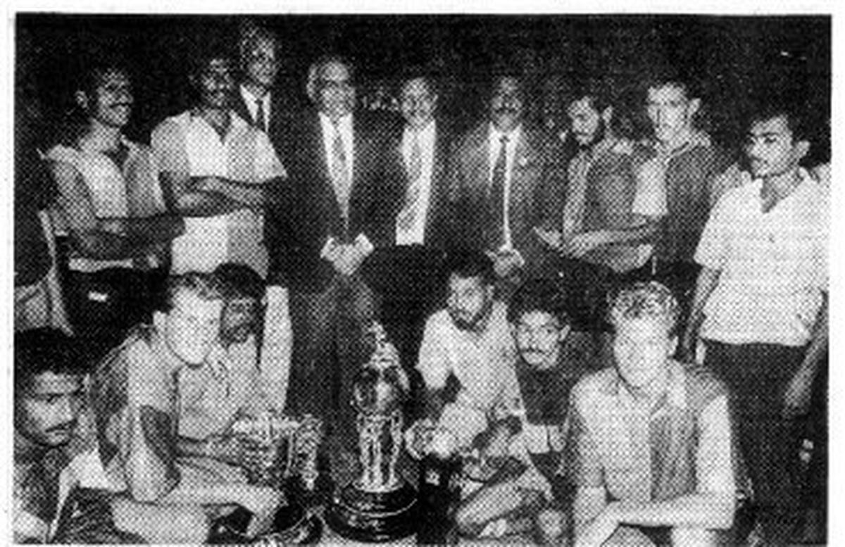 Members of the victorious East Bengal team with the Chief of Air Staff. Air Chief Marshall N. C. Suri (standing fourth from left) after clinching the Durand Cup. 